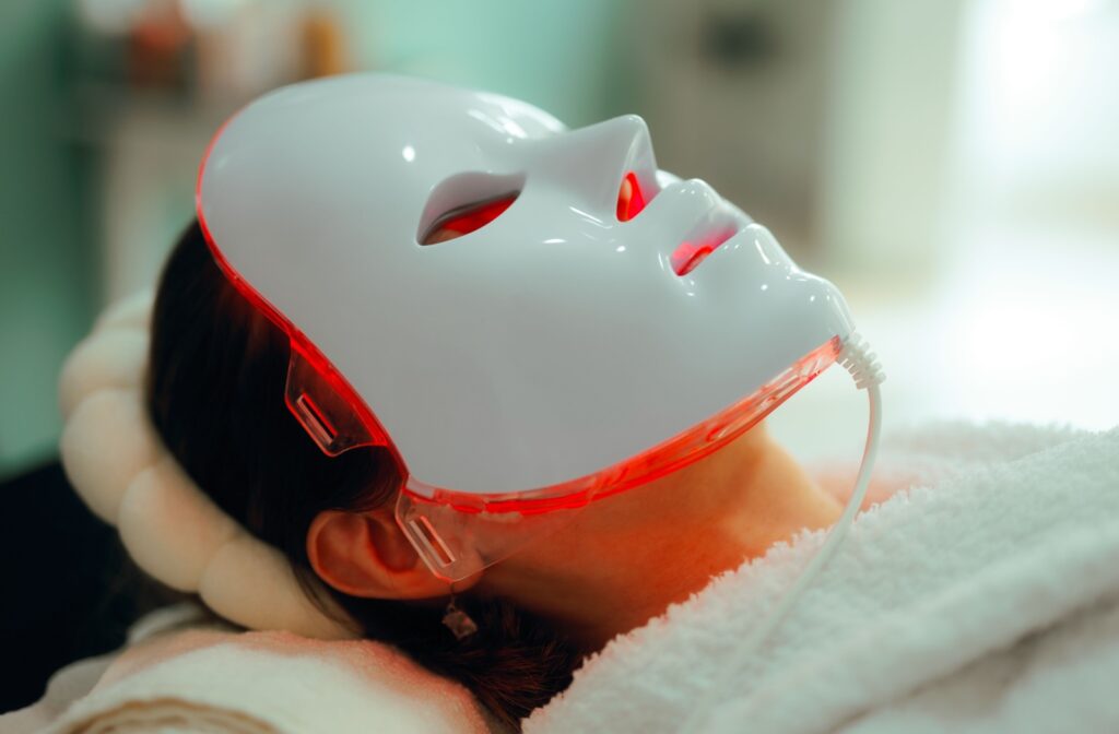 A person wearing a red light mask.